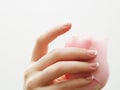 Manicure, Hands spa Beautiful woman hands, soft skin, beautiful nails with pink rose flowers petals. Healthy Woman hands. Beauty s