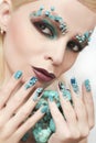 Manicure and makeup with beads and turquoise.
