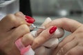 Manicure master files and cleans the client`s nails, close-up.
