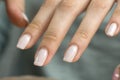 Manicure. Nude nail polish, classic. Overgrown nail polish. Manicure correction. An old manicure. Nail care. Beauty salon, SPA,