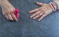 Manicure. Old Woman Hands Polishing Nails With Red Nail Polish In Beauty Salon Royalty Free Stock Photo