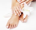 Manicure pedicure with flower lily close up  on white perfect shape hands spa salon Royalty Free Stock Photo