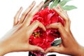 Manicure pedicure people hands concept, woman fingers in shape of heart holding pink rose flowers Royalty Free Stock Photo