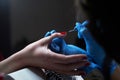 Closeup hands. Manicure procedure in progress - Beautician master applying color nail polish. Royalty Free Stock Photo