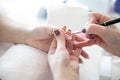 Manicure process in beauty salon - woman hand nails care