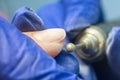 Manicure process, cleaning nails with a milling cutter close up