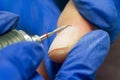 Manicure process, cleaning nails with a milling cutter close up