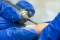 Manicure process, cleaning nails with a milling cutter close up