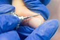 Manicure process, cleaning nails with a milling cutter close up