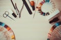 Manicure set and nail polish on wooden background