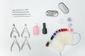 Manicure set. Tools, nail file and palette, care products. White ba Royalty Free Stock Photo