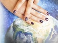 manicure stylish concept: woman fingers with nails purple glitter on nails like cosmos, universe background Royalty Free Stock Photo