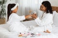 Manicure Time. Loving Black Mom Painting Nails To Her Cute Little Daughter Royalty Free Stock Photo