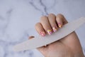 Manicure tools Woman manicured hands, stylish summer colorful nails. Closeup of manicured nails of female hand. Summer Royalty Free Stock Photo