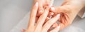 Manicure treatment at beauty spa. A hand of a woman getting a finger massage with oil in a nail salon. Royalty Free Stock Photo