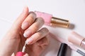 Manicure. A woman paints her nails. The girl applies nail Polish. French. Nail salon, procedure, SPA. Home nail care. Manicure Royalty Free Stock Photo