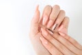 Manicured girl hands on a white background. Pink coral nails