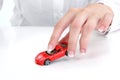 Manicured Female Hand Playing With Toy Car Royalty Free Stock Photo