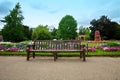 Manicured flower garden with a wooden bench