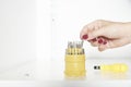 Manicured hand of a young woman choosing a screwdriver tip Royalty Free Stock Photo