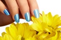 Manicured nails with natural nail polish. Manicure with blue nailpolish. Fashion manicure. Shiny gel lacquer. Spring Royalty Free Stock Photo