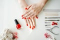 Manicured woman& x27;s nails with red nail polish. Royalty Free Stock Photo