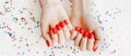 Manicured woman's nails with red nail polish. Royalty Free Stock Photo