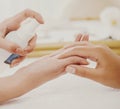 Manicurist Applies Spray to Clients Gentle Hands.