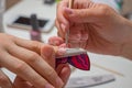 Manicurist makes escalating of nails in beauty salon Royalty Free Stock Photo