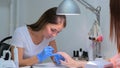 Manicurist master makes manicure Royalty Free Stock Photo