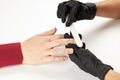 Manicurist work using nail file. a man manicure process. an unrecognizable caucasian person making nail service at spa Royalty Free Stock Photo