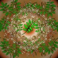 Manifold leaves on beige, orange and green colors Royalty Free Stock Photo
