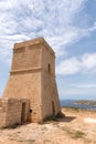 Panorama of Gnejna bay, the most beautiful beach in Malta at sunset with beautiful colorful sky and golden rocks Royalty Free Stock Photo