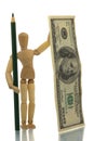 Manikin with pencil and money Royalty Free Stock Photo