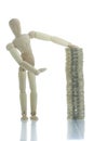 Manikin pointing to coins pile