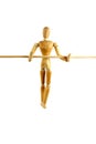 Manikin walking a tightrope