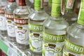 Smirnoff Vodka, in both green apple and original red label variants for sale at a supermarket or Royalty Free Stock Photo