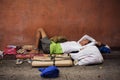 Homeless filipino man sleeping at the street