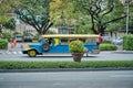 Manila, Philippines - Feb 02, 2020: Jeepneys on the roads of Manila. Former American military jeeps converted to public