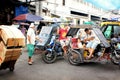 Road traffic in Manila, Philippines, with the typical tuk tuks