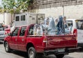 Pickup truck full of Virgin Mary statues in Manila, Philippines