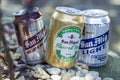 Cans of San Miguel Super Dry, Lemon Flavored Beer and San Mig Light for display outside at a