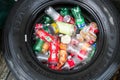 Manila, Philippines - October 2, 2018: used tire filled with used plastic bottles