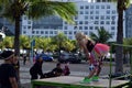 Zumba Dancing instructor leading mature women in morning exercise at bay park