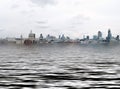 Manipulated conceptual image of the city of london with buildings flooded due to global warming and rising sea levels and gulls Royalty Free Stock Photo