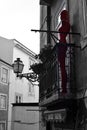 Maniqin on the balcony. Old Lisbon street photo. Art. Red black and white. Lantern. Building Windows. Emotions. Beautiful