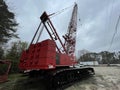 Manitowoc Red Crane Construction scene cloudy rainy day back corner view