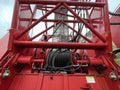 Manitowoc Red Crane Construction scene cloudy rainy day cable spool