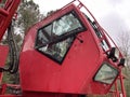 Manitowoc Red Crane Construction scene cloudy rainy day side cab view