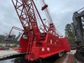 Manitowoc Red Crane Construction scene cloudy rainy day side view bottom